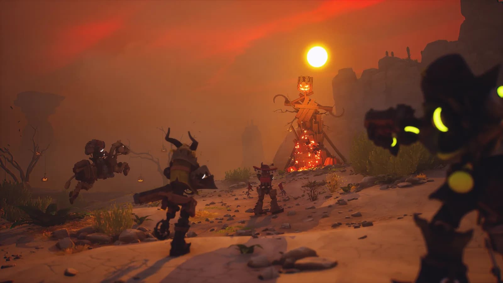 Far Far West robot cowboys walk toward a burning pumpkin-headed effigy in a desert under a red Halloween sky