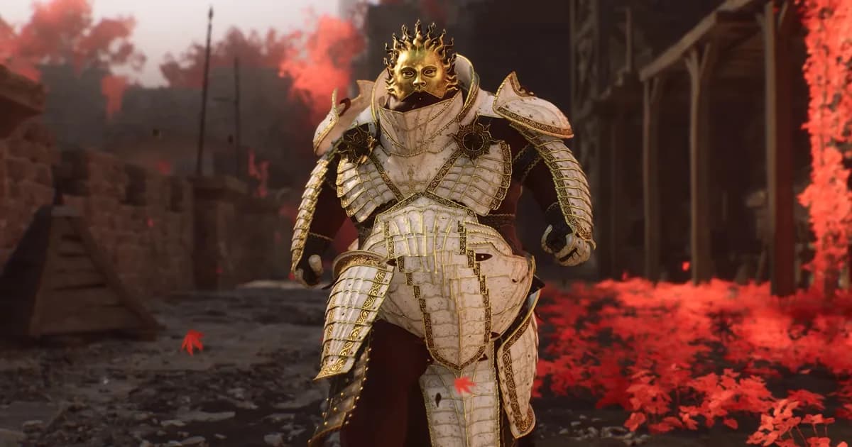A Shell in ornate gold armor and a crowned helmet walks down a stone street covered in red autumn leaves
