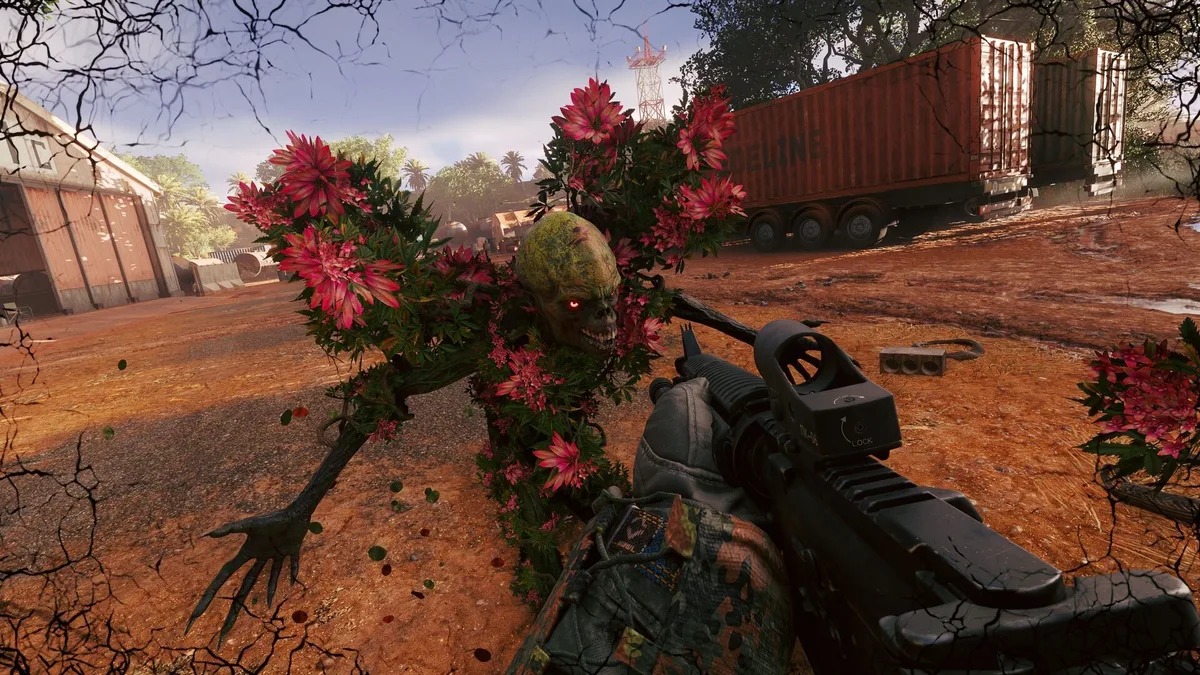 First-person view of a red flower-covered creature lunging across orange dirt toward the player's rifle