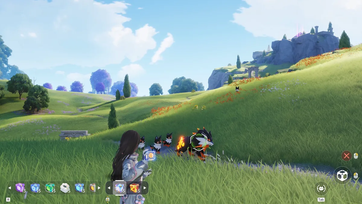 A player character in white armor captures a pack of fire-wolf Aniimo on a grassy hillside near ancient ruins, with an item hotbar showing capture tools