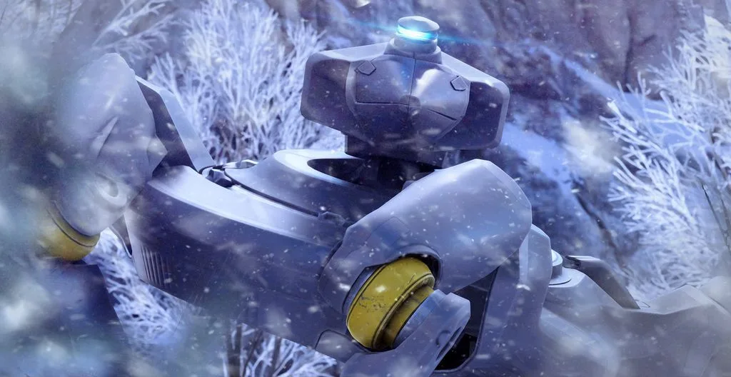 Pale blue armoured ARC machine with a yellow joint lying in snowy undergrowth, flakes blurring the foreground