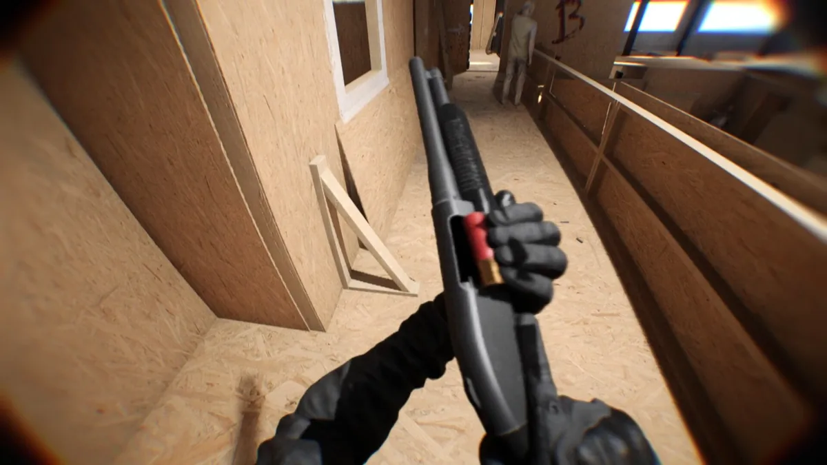 Bodycam first-person pump-action shotgun aimed down a plywood-walled indoor corridor with an opposing player visible near a spray-painted B callout