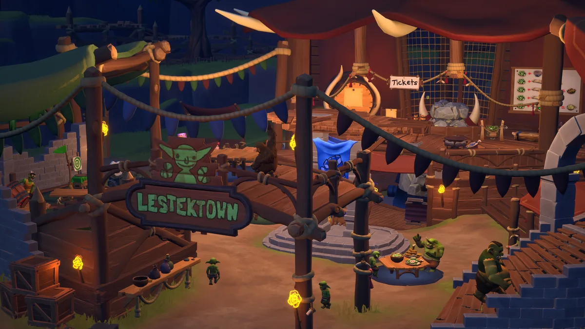 A nighttime goblin settlement in Bronzebeard's Tavern 2's pre-alpha build, with a wooden "Lestektown" signpost, a "Tickets" recipe board, rope-strung banners, and a goblin eating at a market table