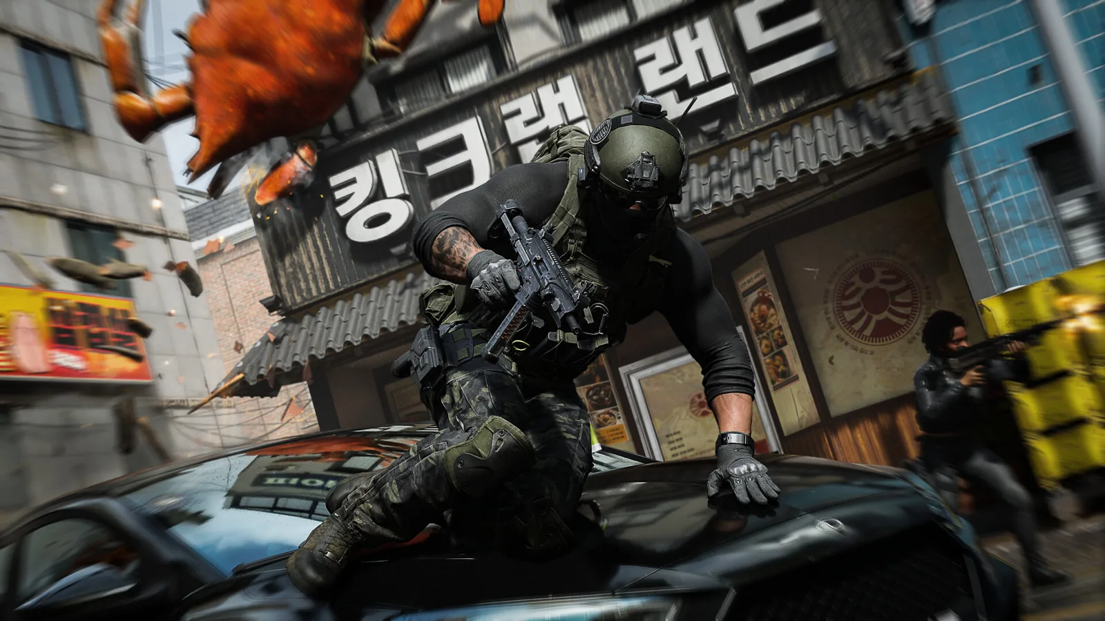 A soldier vaults over a black car in front of a shop with Korean signage while a gunman fires from behind yellow crates