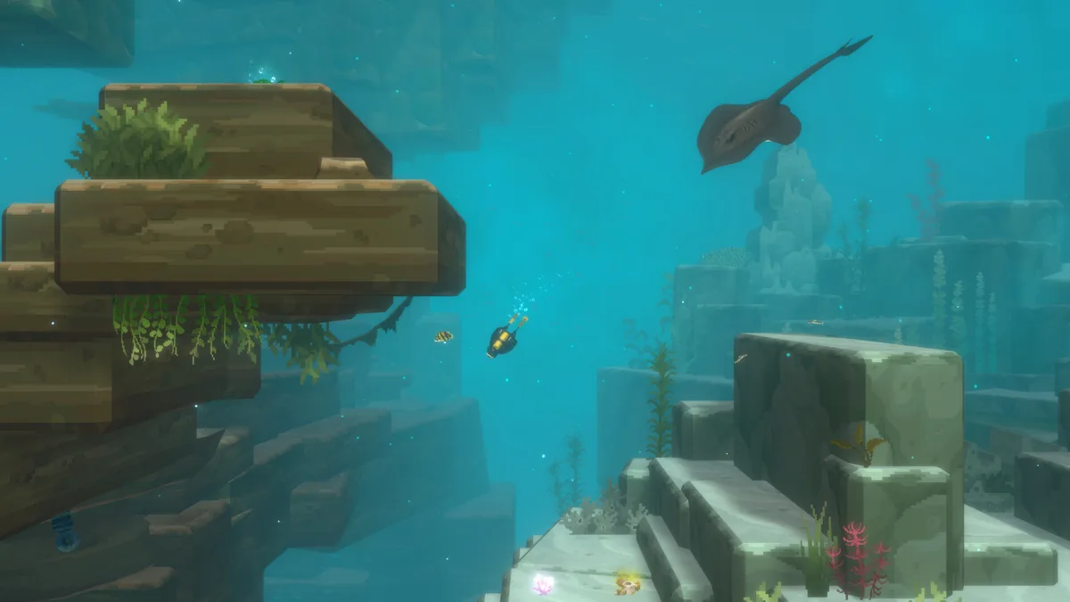 A diver encounters a large Giant Freshwater Stingray gliding past mossy rock formations in a blue-green underwater cavern