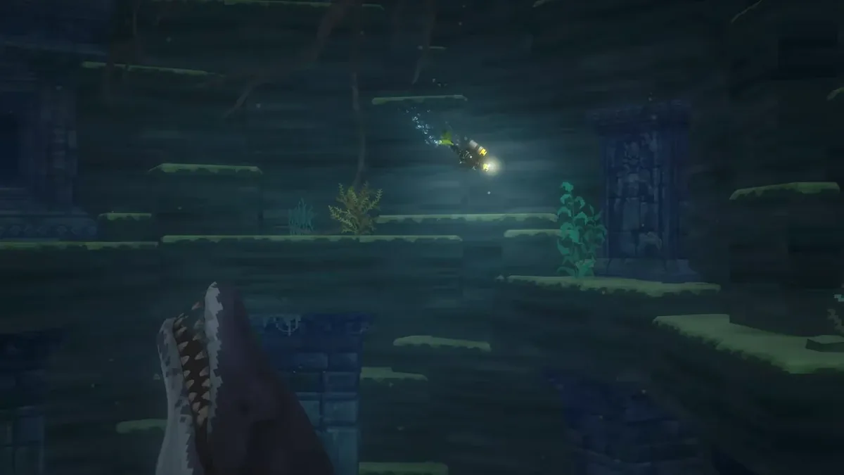Dave swims above dark ruins in the deep lake while a huge toothed fish rises from the shadows below