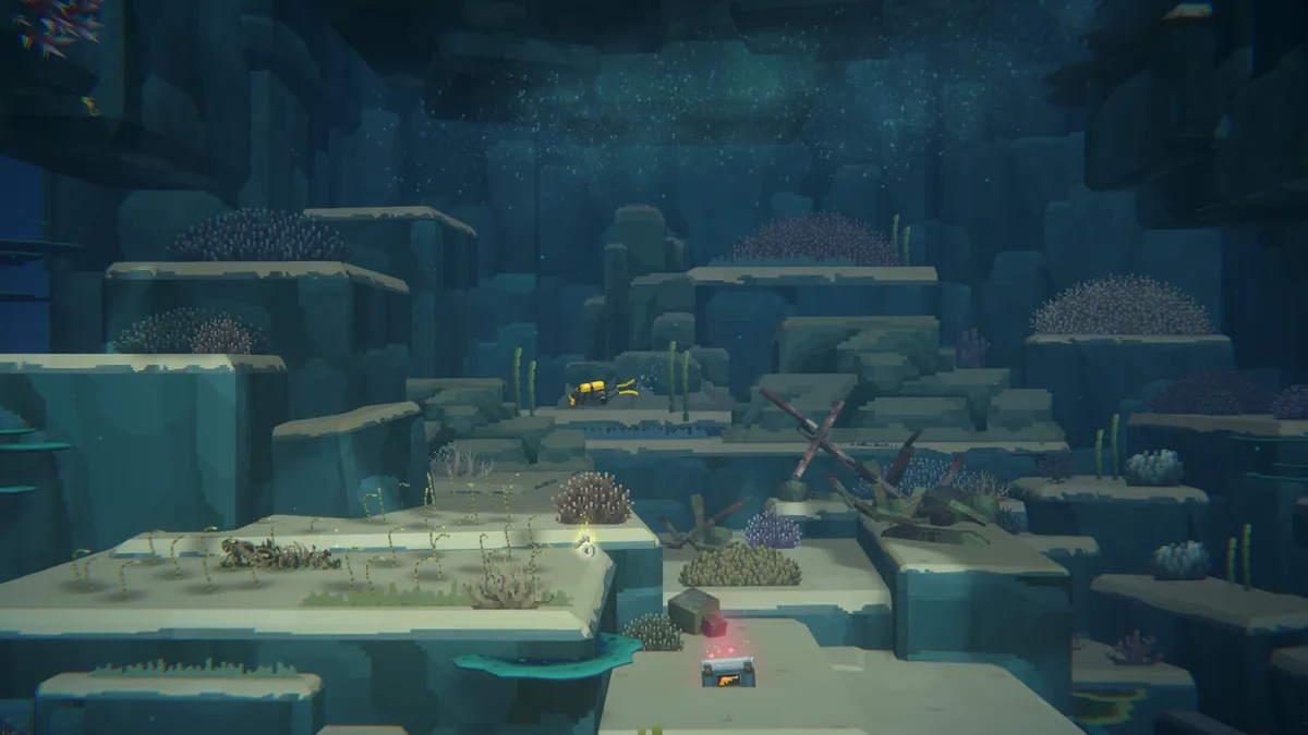 Diver exploring a rocky underwater reef structure past coral formations and a shipwreck, sunlight filtering from above
