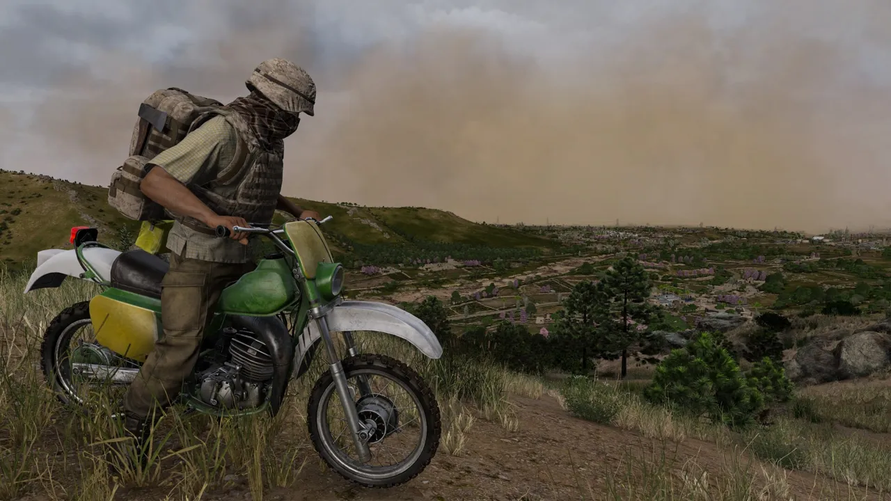 A survivor in a helmet and backpack sits on a green dirt bike on a grassy ridge as a sandstorm rolls in behind