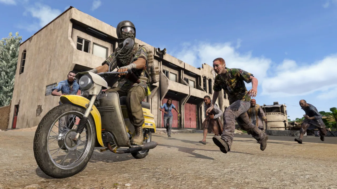 A helmeted survivor rides a yellow motorbike down a dusty town street while infected run after him