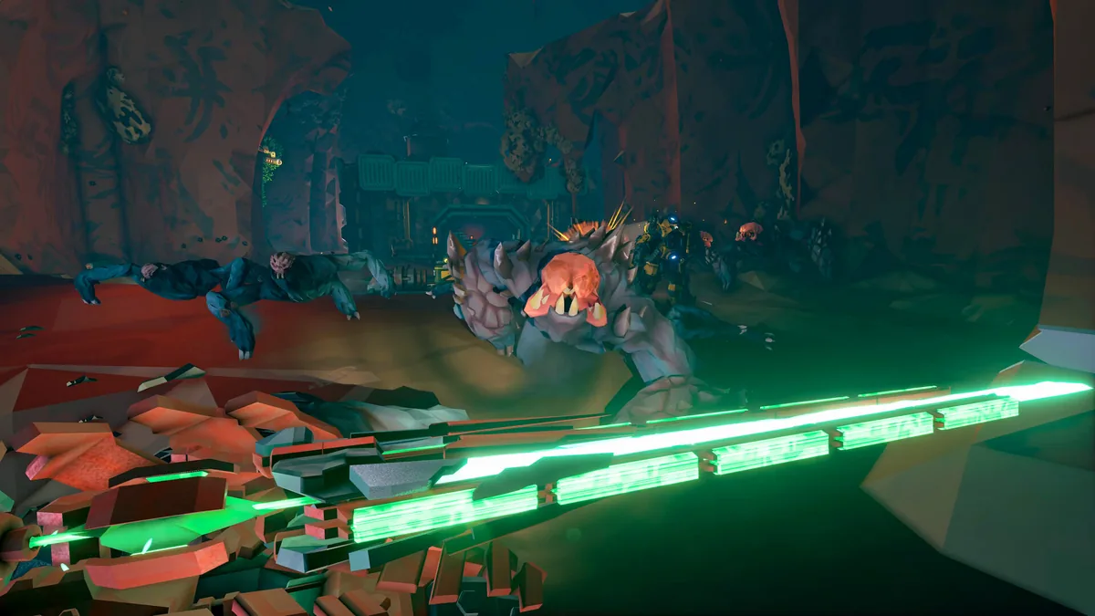 Deep Rock Galactic Rogue Core squad firing into a dense alien swarm in a green-lit underground corridor