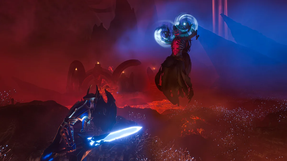 A red-lit lava landscape where a floating caster with glowing rings faces a player holding a glowing blue blade