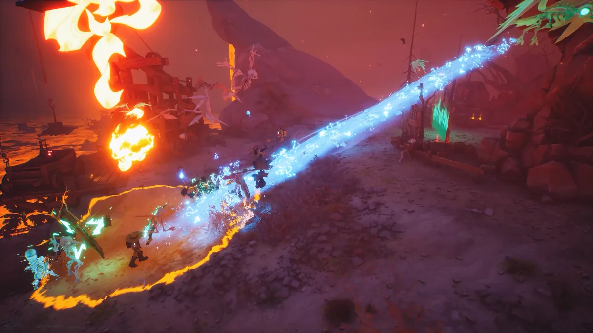A blue frost beam and a burning skull blast cutting through skeleton enemies in a dusty red Far Far West canyon