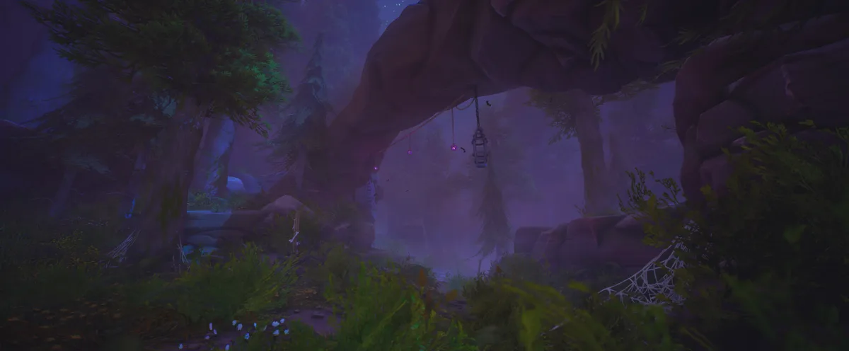 A dark purple-lit forest path under a rock arch with a hanging lantern and cobwebs in the undergrowth