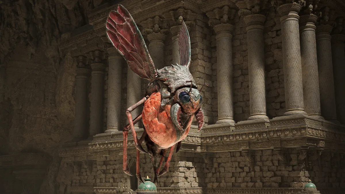 Fatekeeper encounter in columned temple ruins, an orange-armored enemy character visible against crumbling stone pillars and warm light