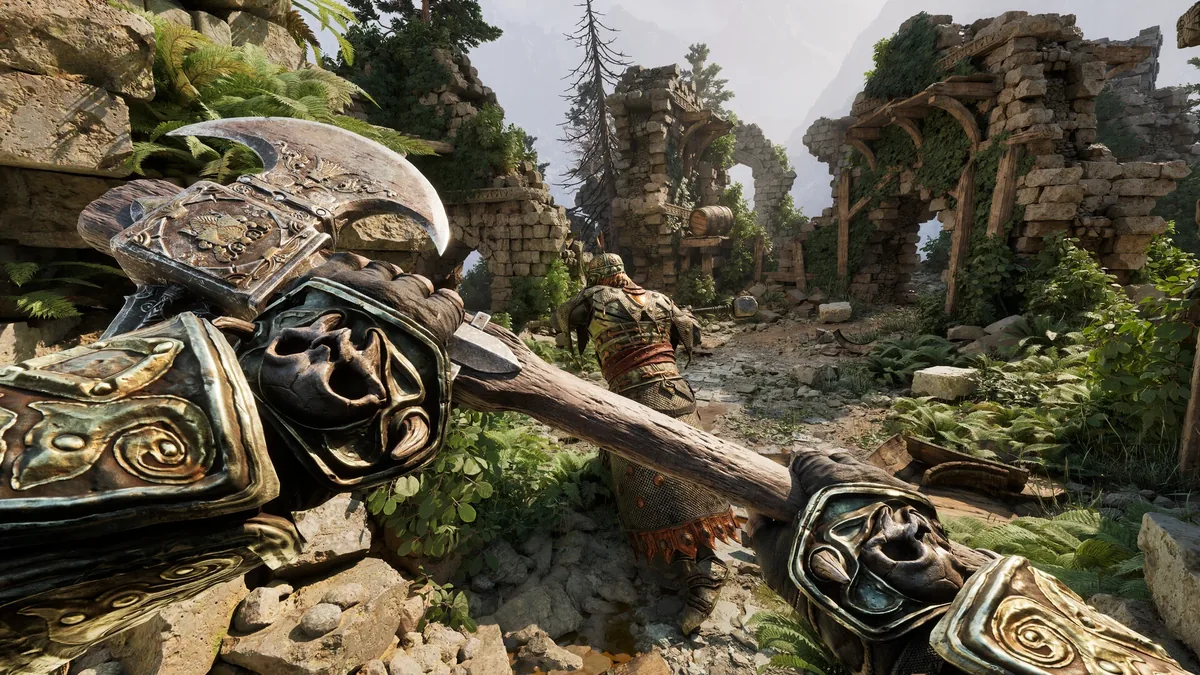 Fatekeeper combat near ruined stone arches, the player swinging an ornate hammer at an enemy among overgrown columns