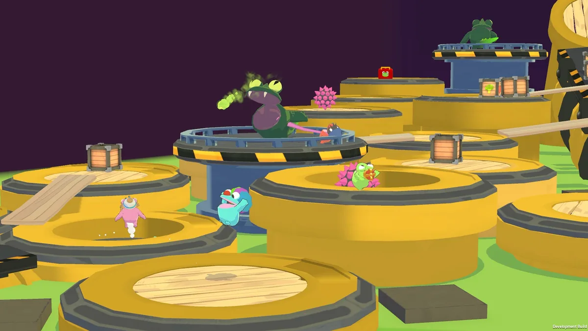A large glowing Megafrog standing on a circular platform surrounded by pink hazard spikes, with smaller frogs navigating the outer rings of yellow barrel platforms