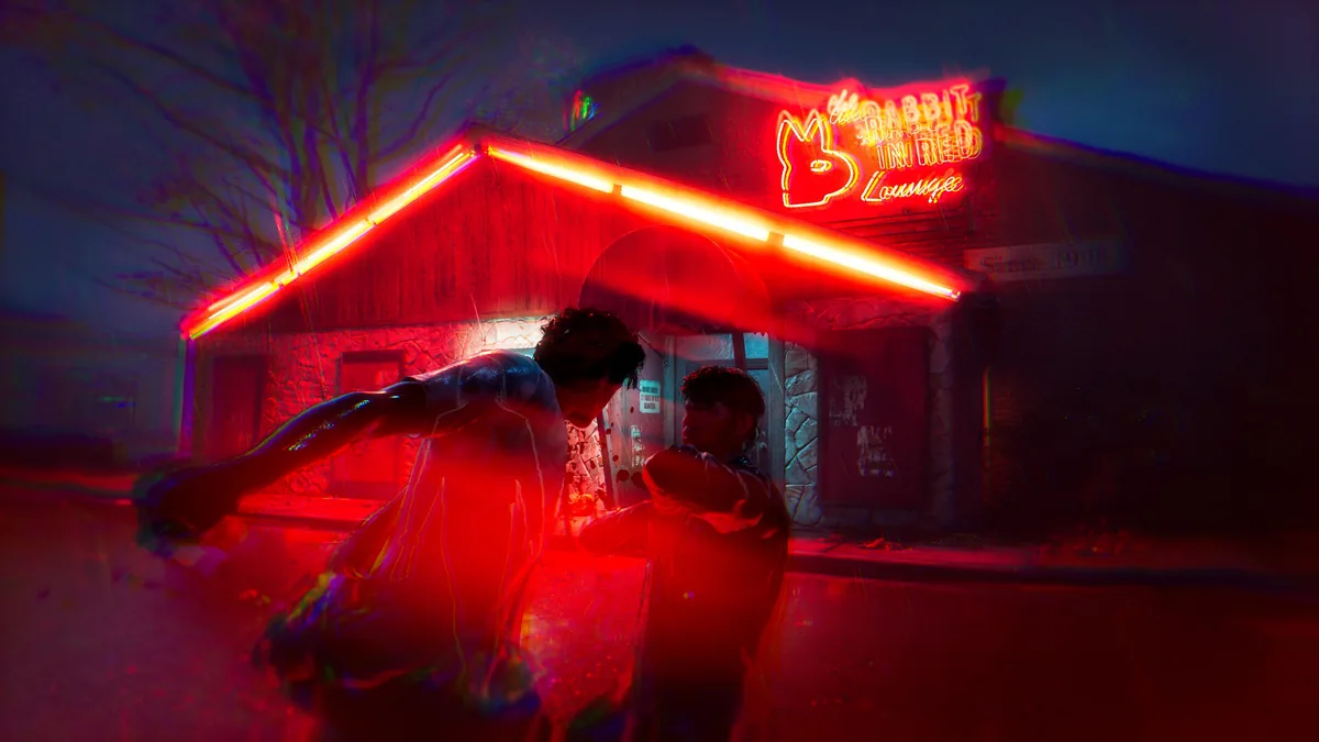 Two figures fighting near a neon-lit building reading Rabbit in Red Lounge under red lighting and rain