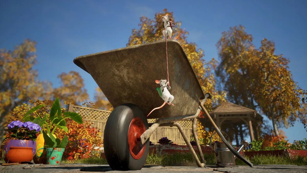 Two white mice climb a rope up the side of a rusty wheelbarrow in an autumn garden