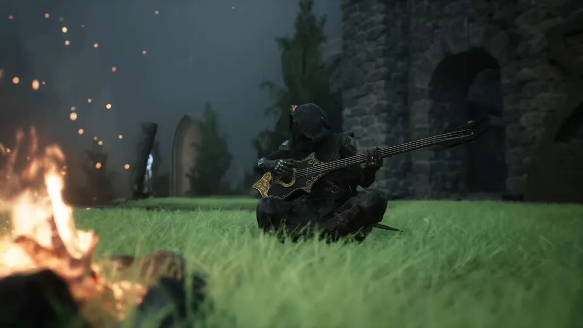 A hooded figure sits on the grass beside a campfire playing a dark lute at night