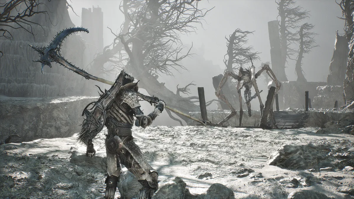 An armored figure with a curved polearm weapon facing a tall, spindly white creature with elongated limbs across an ash-gray wasteland of dead trees and stone ruins