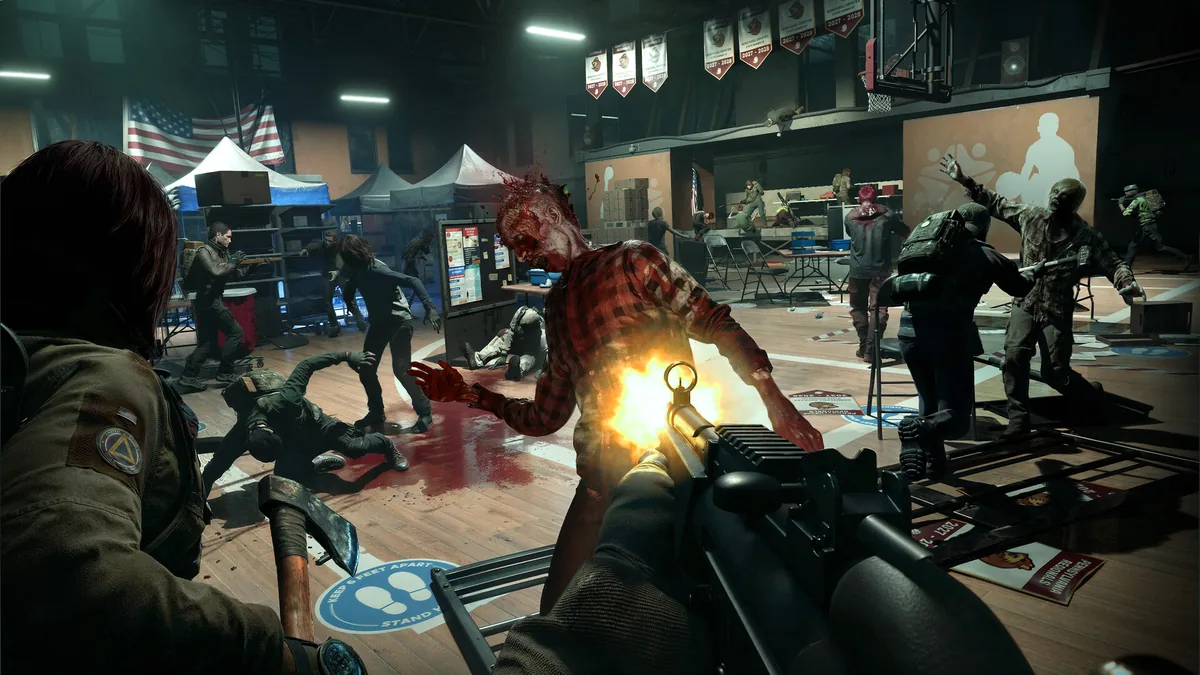 First-person view of a Responder firing a scoped rifle at an advancing zombie inside a school gymnasium converted into a supply distribution center