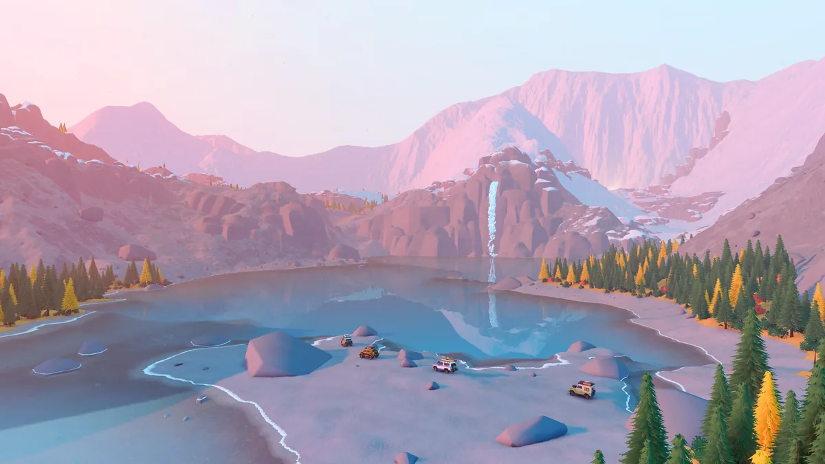 Four off-road vehicles cross a cold lake below snowy mountains and a waterfall