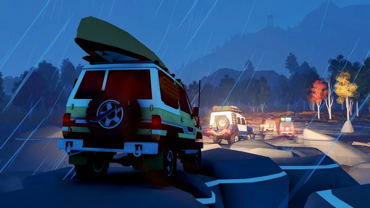 White and green 4x4 vehicles cross a rocky trail in heavy rain, with a canoe on the lead vehicle's roof