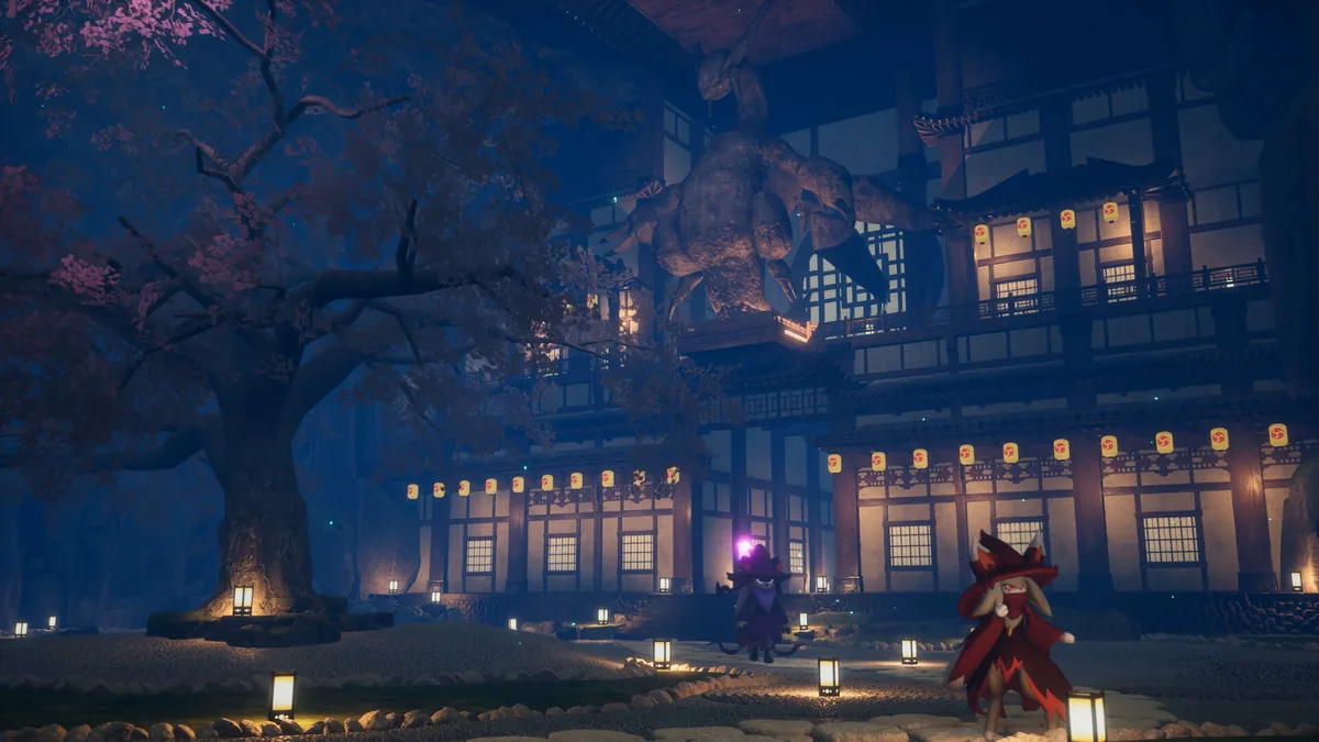 A massive dragon-like creature looms over a lantern-lit shrine at night as two small characters approach along a stone path