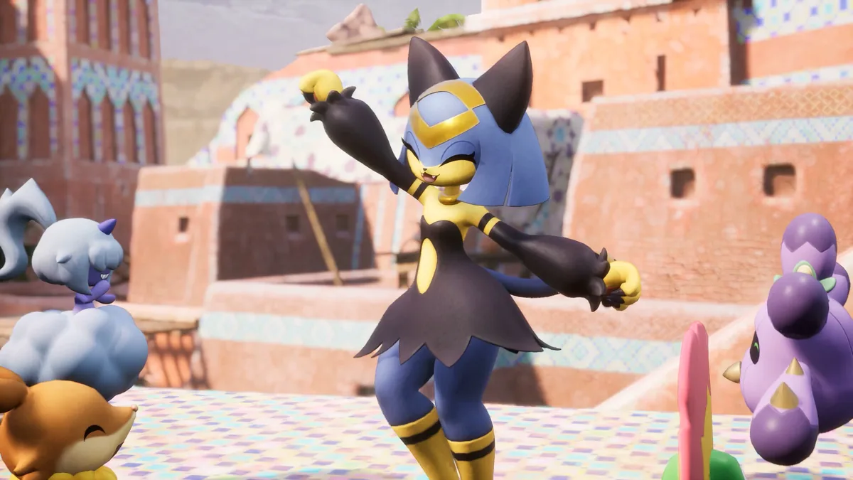 Katress, a blue and black cat-styled humanoid Pal, poses on a sandstone rooftop beside a pale blue fox-like Pal and two purple round Pals