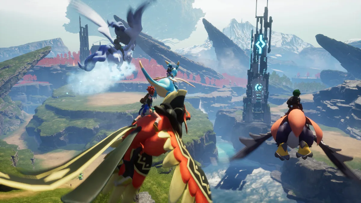 Four players ride winged Pals, including a red dragon-like Pal and a blue crested Pal, over a misty canyon toward a glowing blue tower