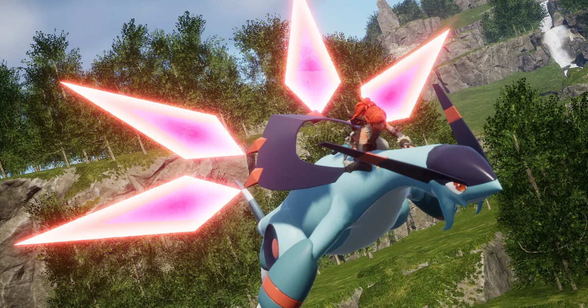 A rider on a blue and purple dragon-like Pal fires pink crystal blade projectiles while flying over a green forested hillside, a waterfall visible in the distance