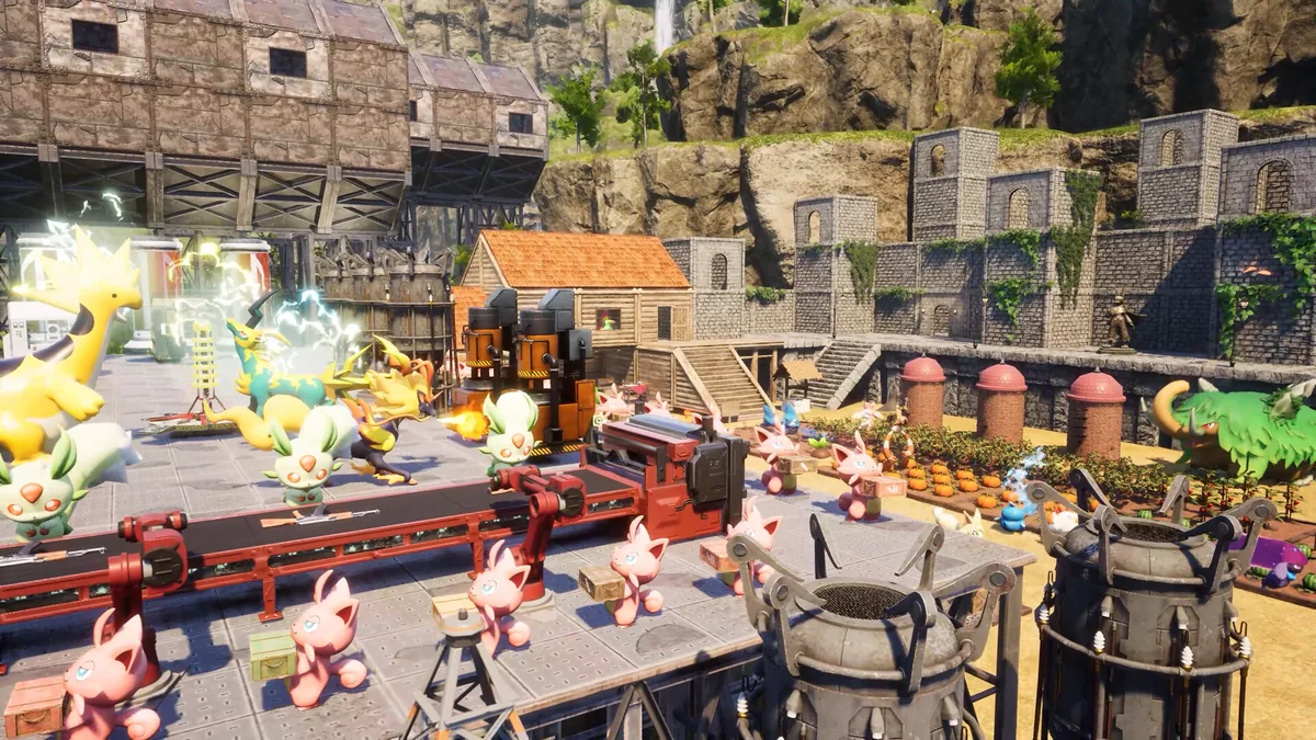 Pink rabbit-like Pals carry crates on a conveyor belt past pumpkin crops and storage silos inside a walled Palworld base