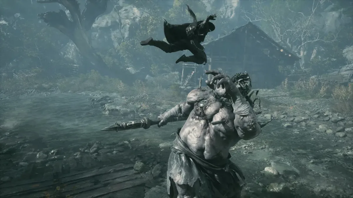 A hulking pale brute swings a spear while a cloaked fighter leaps over him in a rain-soaked courtyard