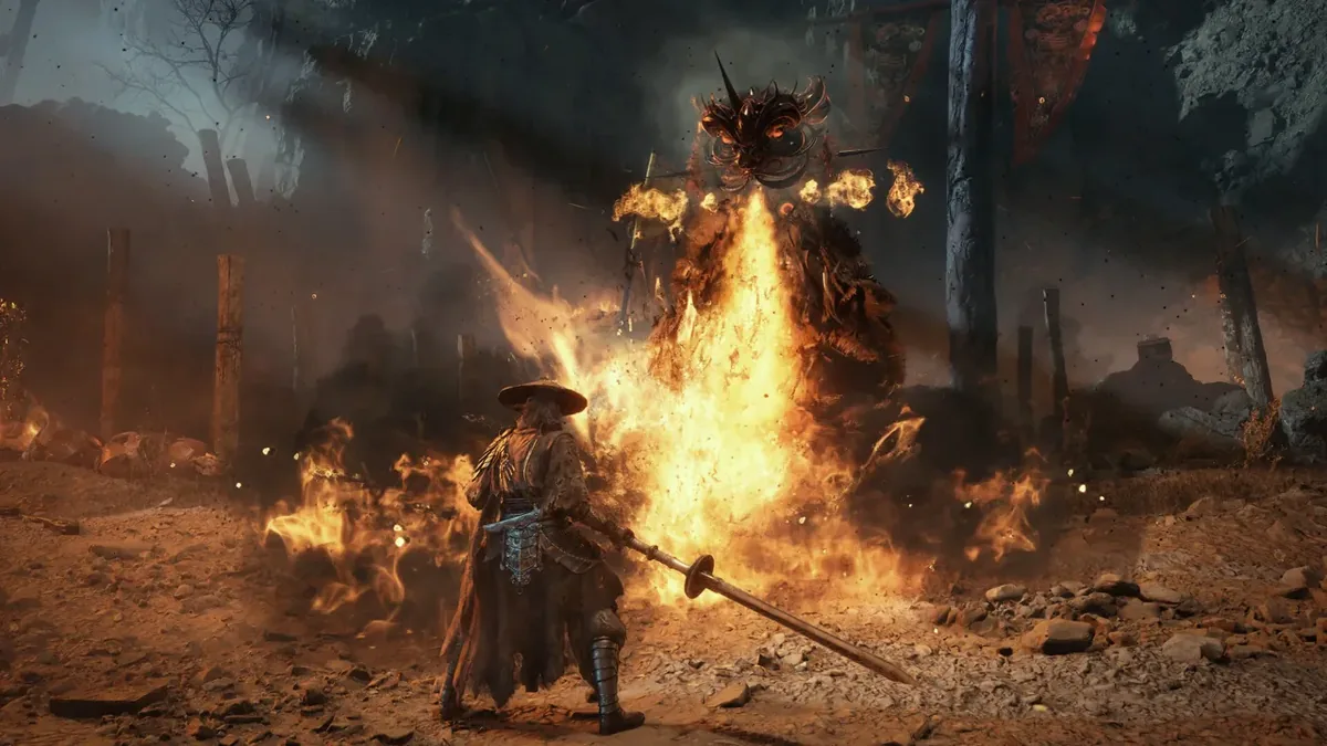 Soul in a wide straw hat holds a long spear as a fire-wreathed demon rises behind a wall of flame