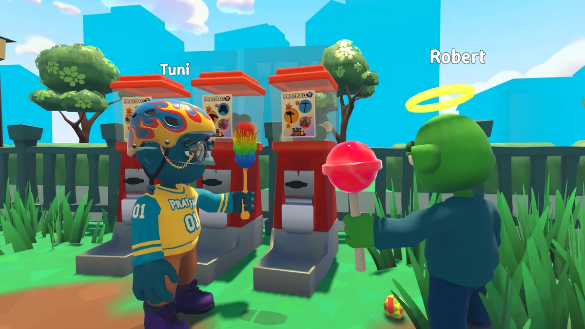 Two Pratfall players in the park in front of a row of red gumball machines, one in a helmet and jersey, one green with a halo
