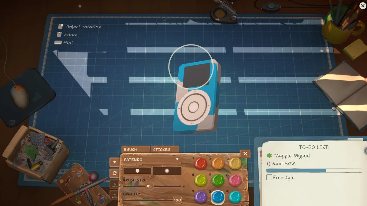 Customizing a Mapple Mypod music player in ReStory's paint tool, brush at size 45 and opacity 100, with a nine-color Patendo palette open below