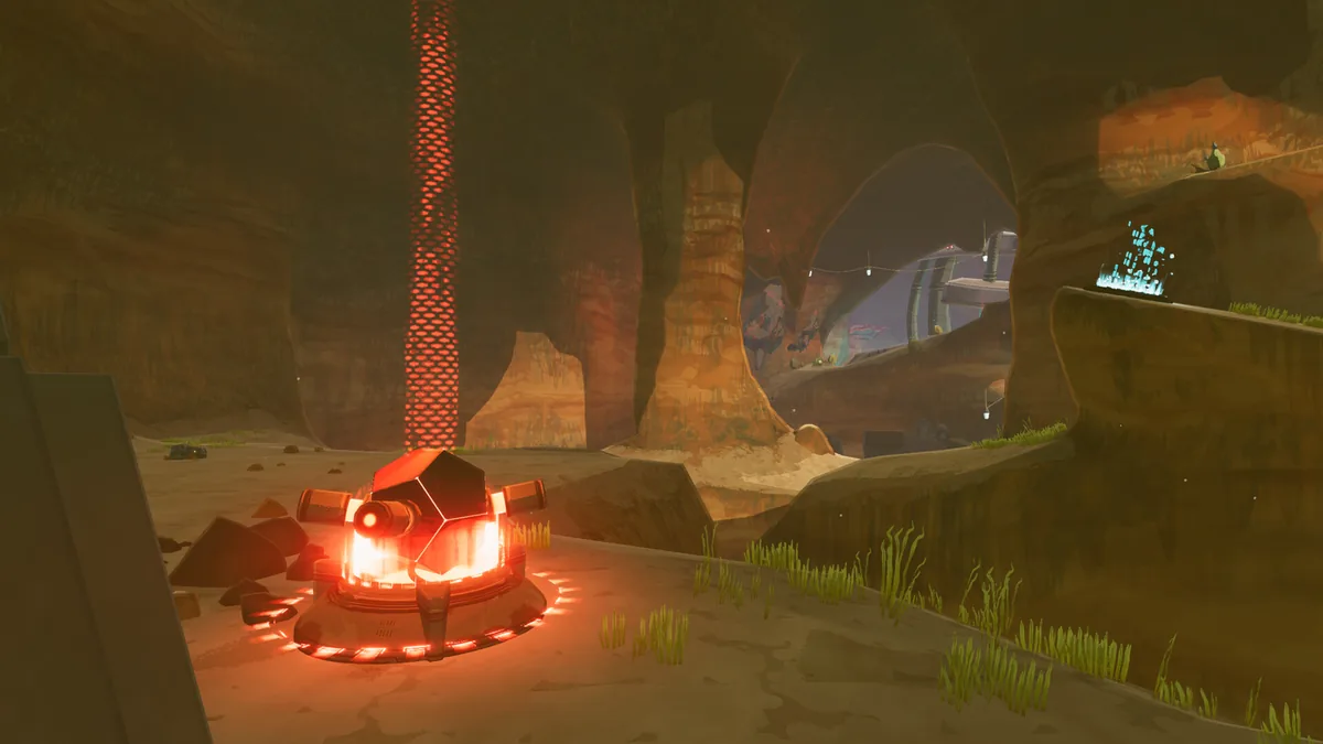 Risk of Rain 2 defensive turret structure glowing red and orange, positioned on a rocky ledge overlooking a canyon