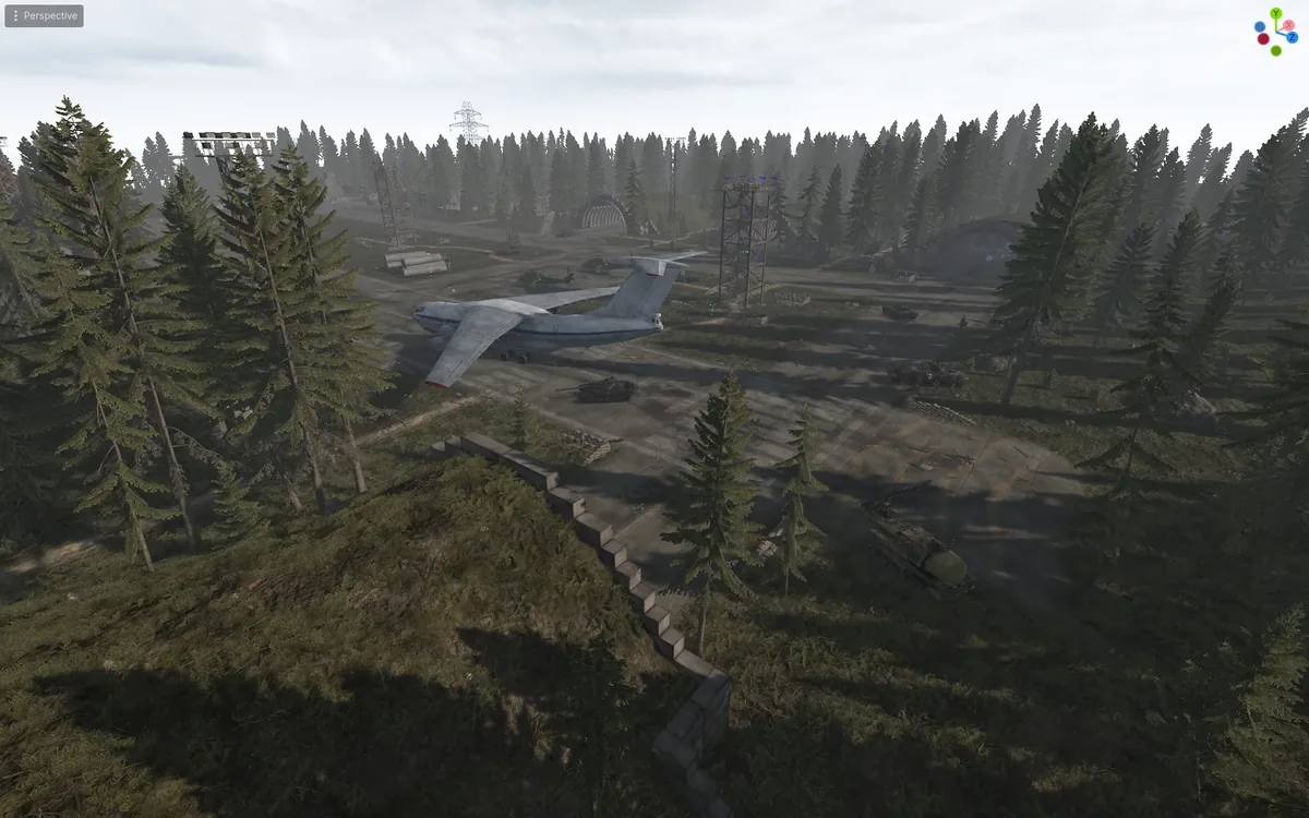 Editor view of the Airfield map: a large grey cargo plane, tanks and armored vehicles on a concrete airstrip surrounded by pine forest