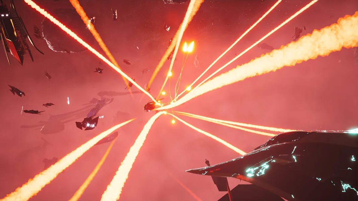 A dozen tracer-fire lines converge on a burning target during a red-lit dogfight, with a cracked capital ship glowing cyan in the foreground