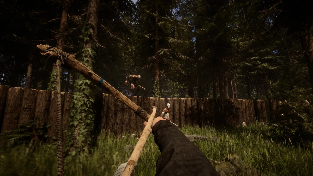 Sons of the Forest player aiming a spear at two approaching hostile mutants near a wooden perimeter wall in a forest clearing