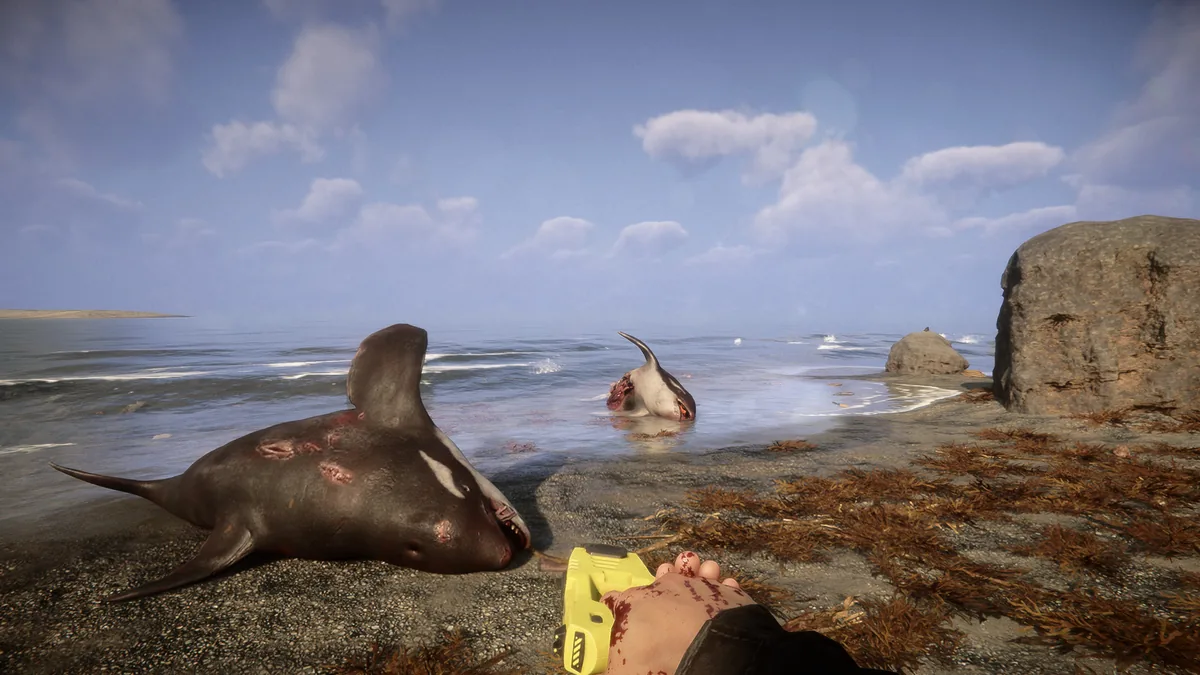 Sons of the Forest first-person view of a hand holding a yellow stun gun near two bloodied shark carcasses on a rocky shoreline