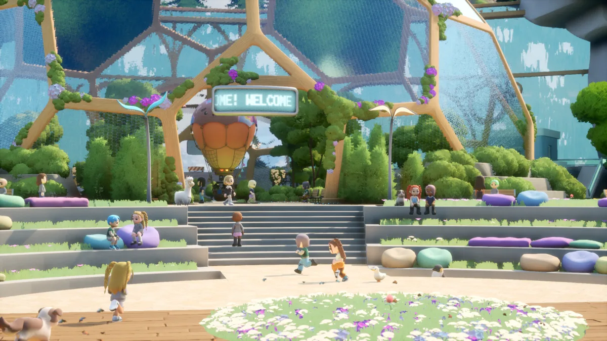 Domed plaza with a Hi! Welcome sign, flower beds and small player avatars gathered on the steps