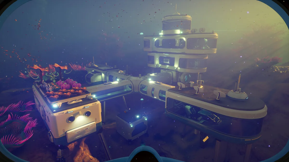 Subnautica 2 base with a docked submersible beside illuminated habitat modules