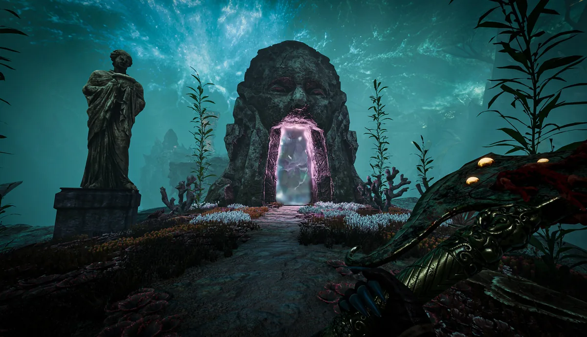 A carved stone shrine with a glowing portal-like mouth surrounded by coral and a weathered statue in the underwater ruins