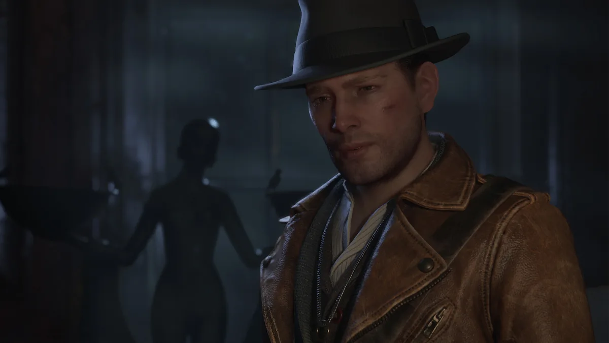 Close-up of a bruised protagonist in a fedora and worn leather jacket, with a shadowy humanoid figure visible in the dim background behind him