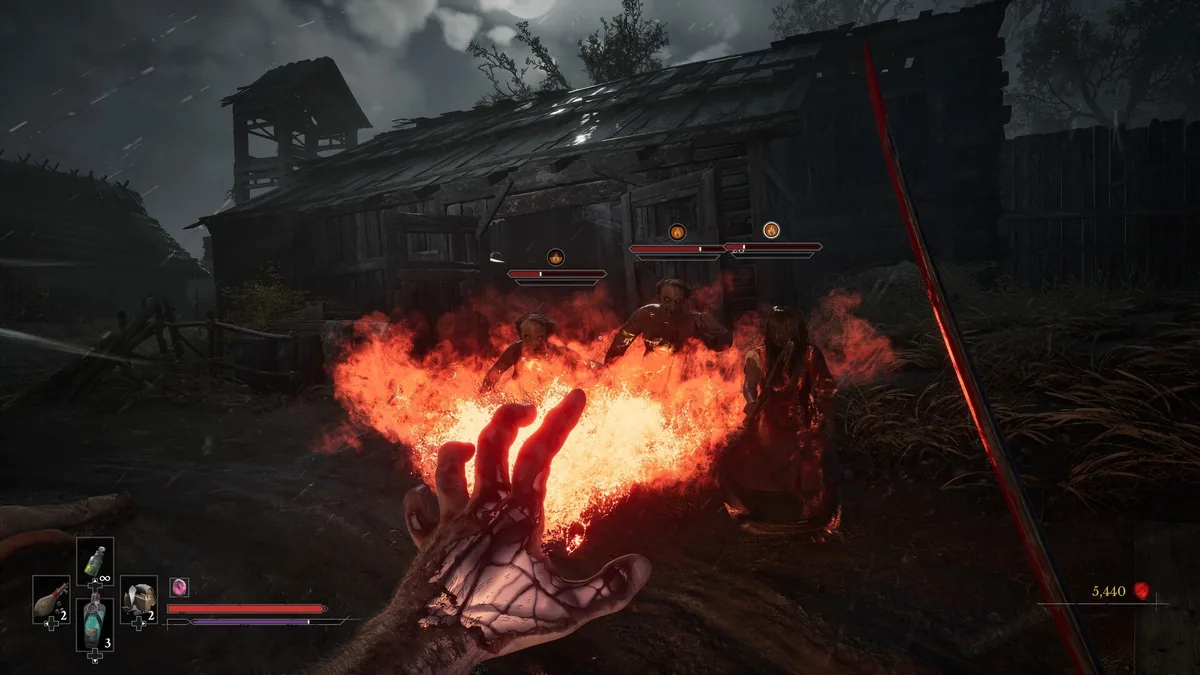 A first-person hand channels fire at enemies outside a wooden building