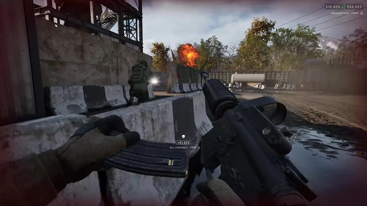 First-person rifle fire behind a concrete barrier with a KILL CONFIRMED notification, 275XP and a cash reward displayed, an explosion visible past a teammate in the distance